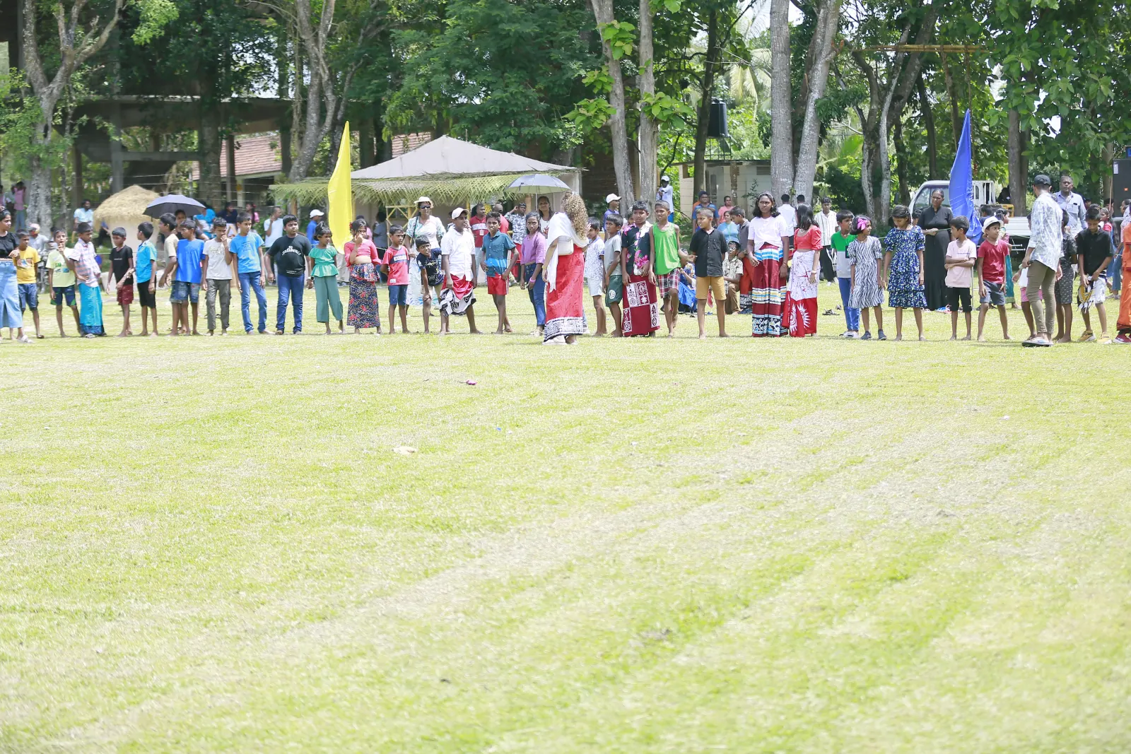 Students and families gathering for an outdoor community event