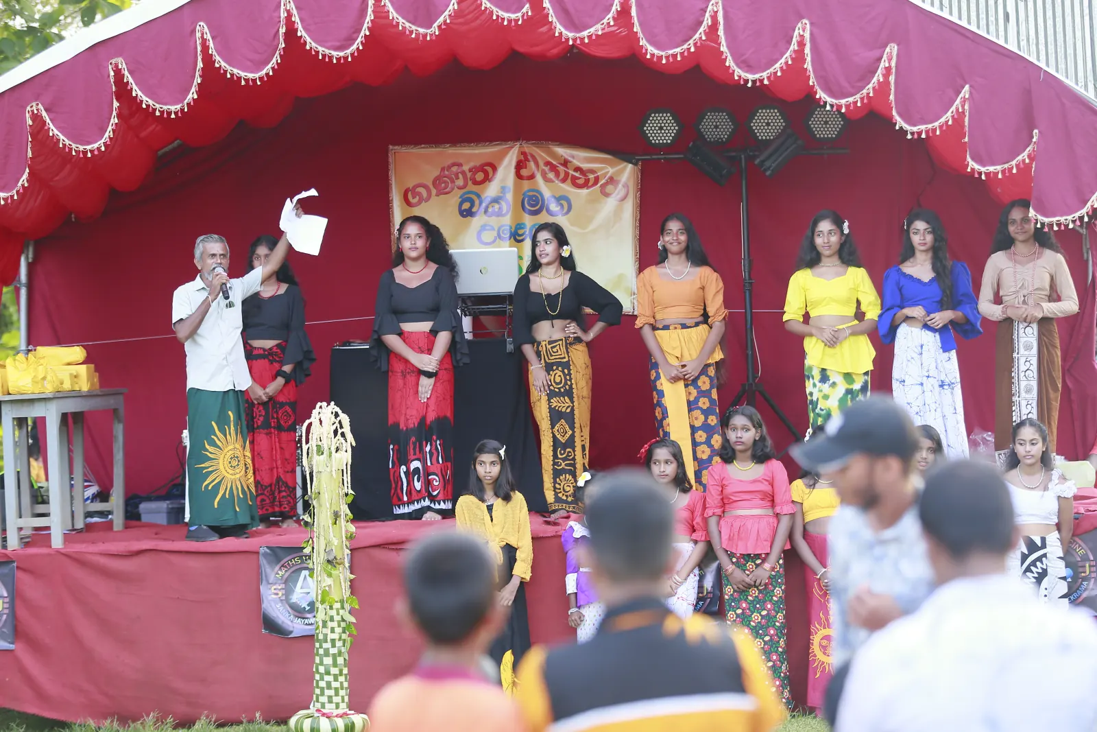 Students taking part in a cultural presentation on the Ganitha Ennatha event stage